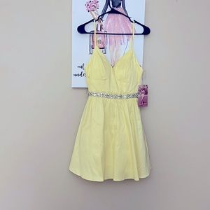 Beautiful brand new dress for spring with a little touch of bling